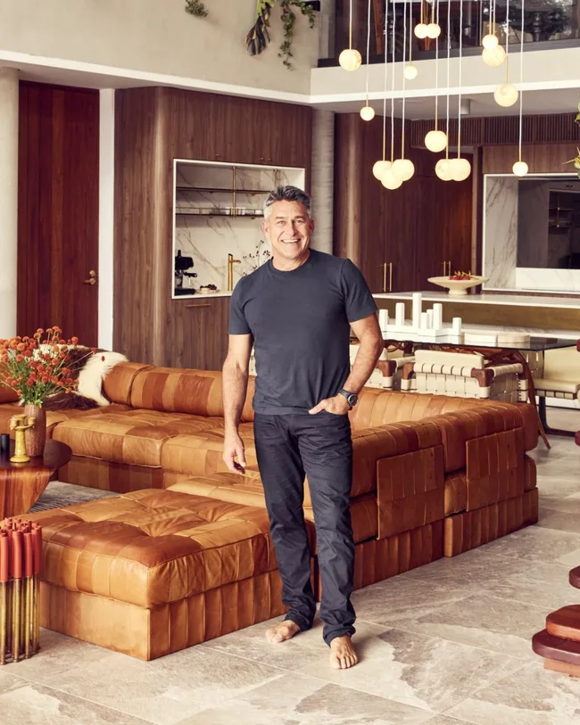 jamie Durie stands in his Avalon home wearing black jeans and a black t shirt.