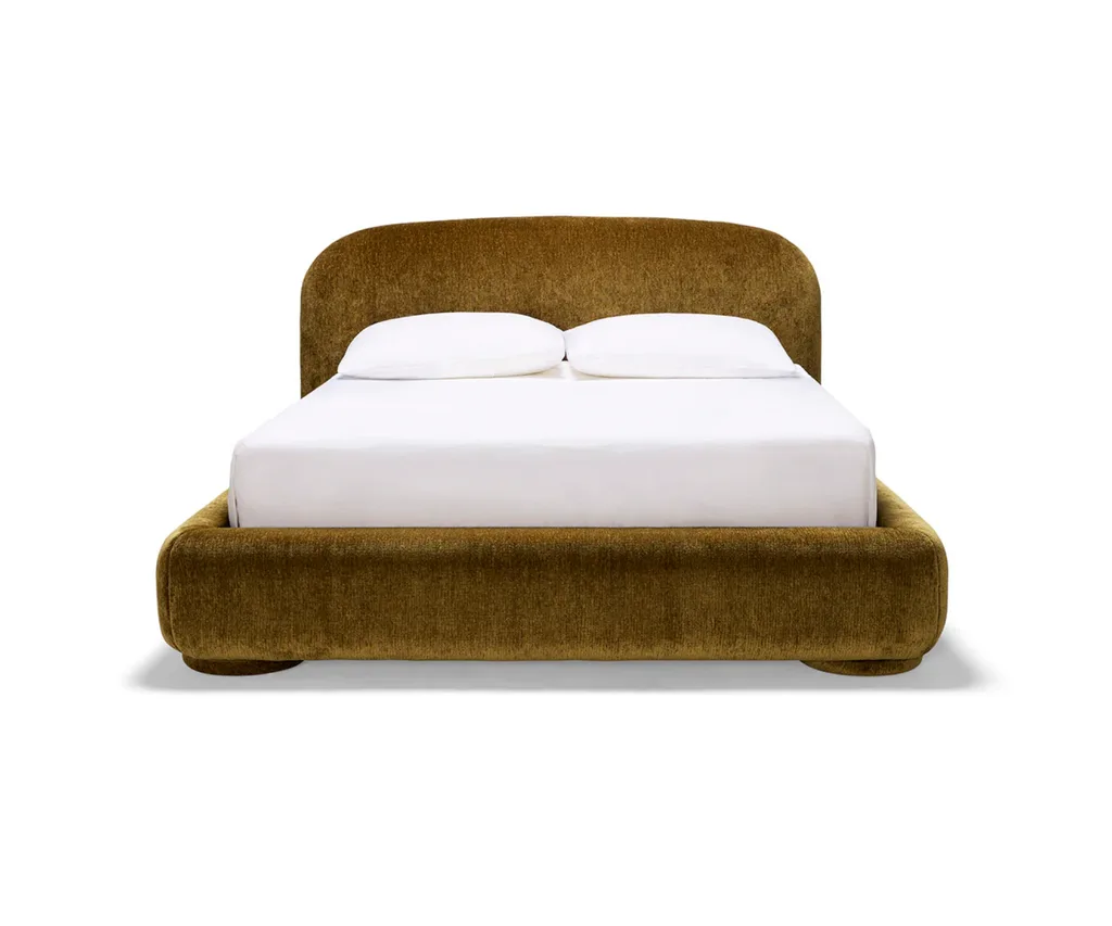 A rounded cloud-style bed by Ellison Studios