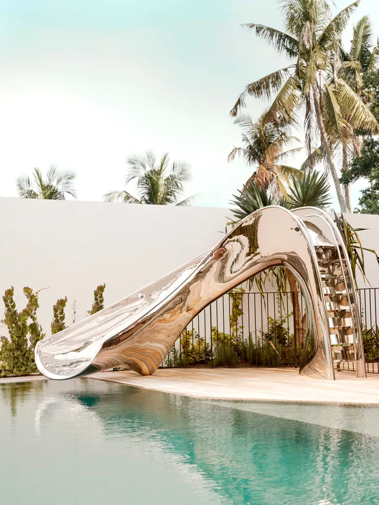 Coastal holiday home pool with slide