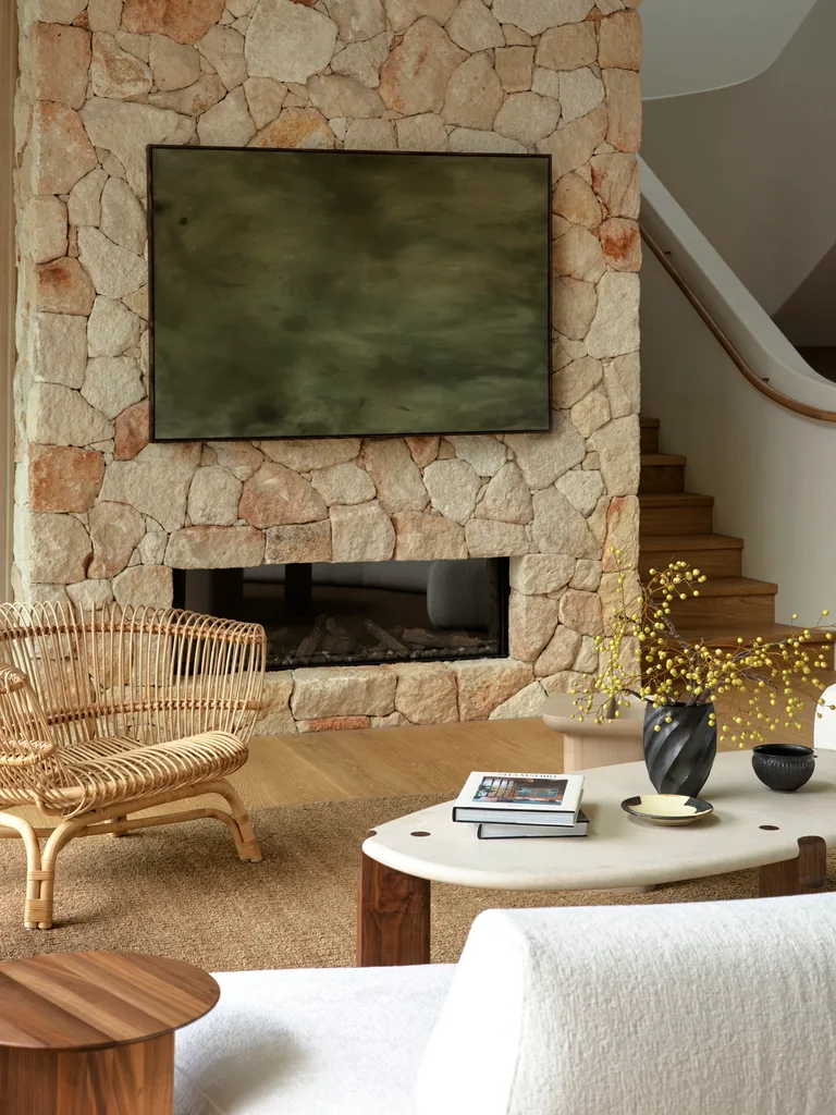 Coastal holiday home stacked stone fireplace