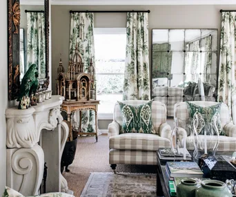 A living room filled with antiques and green accents