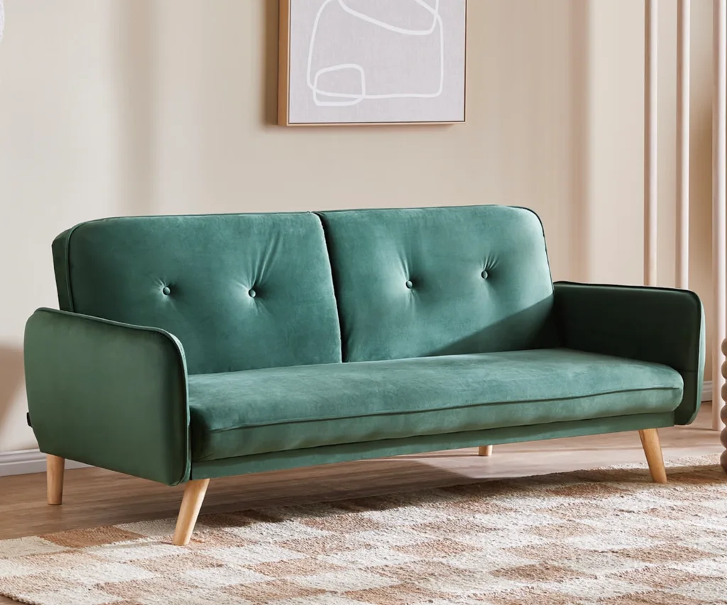 Temple & Webster's Chelsea 3-seater sofa bed in dark green.