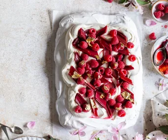 Pavlova with roasted rhubarb, raspberries and yoghurt cream