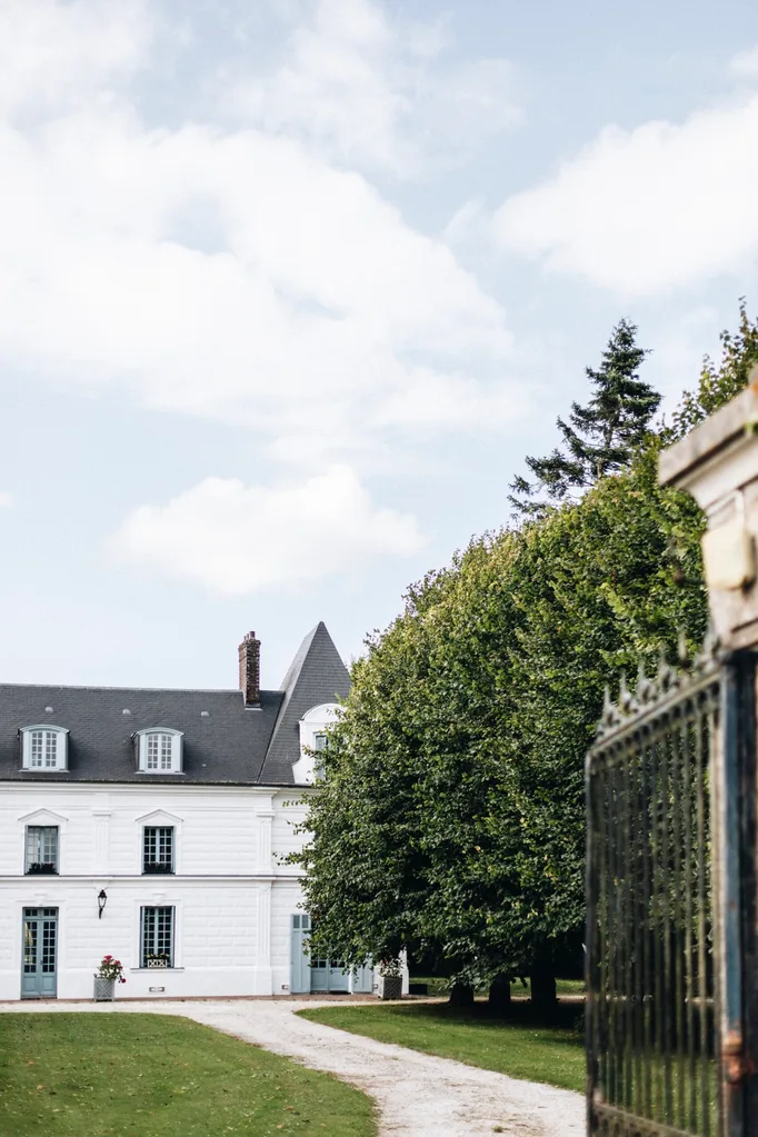 A white, French-style chateau in Normandy.