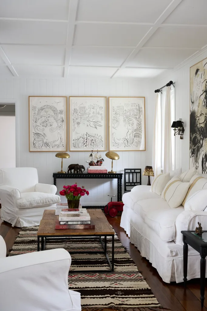 A cosy lounge area with white sofas