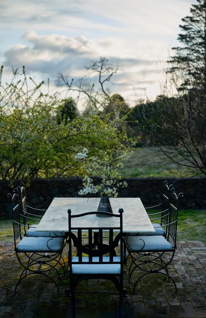 An outdoor dining area surrounded by trees