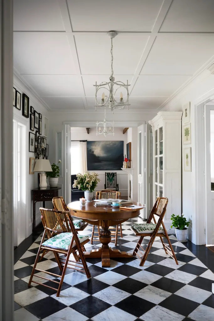 A dining area with checkerboard flooring