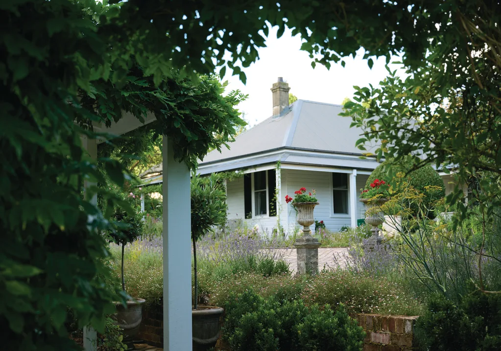 A view of Collette Dinnigan Southern Highlands home from a leafy garden