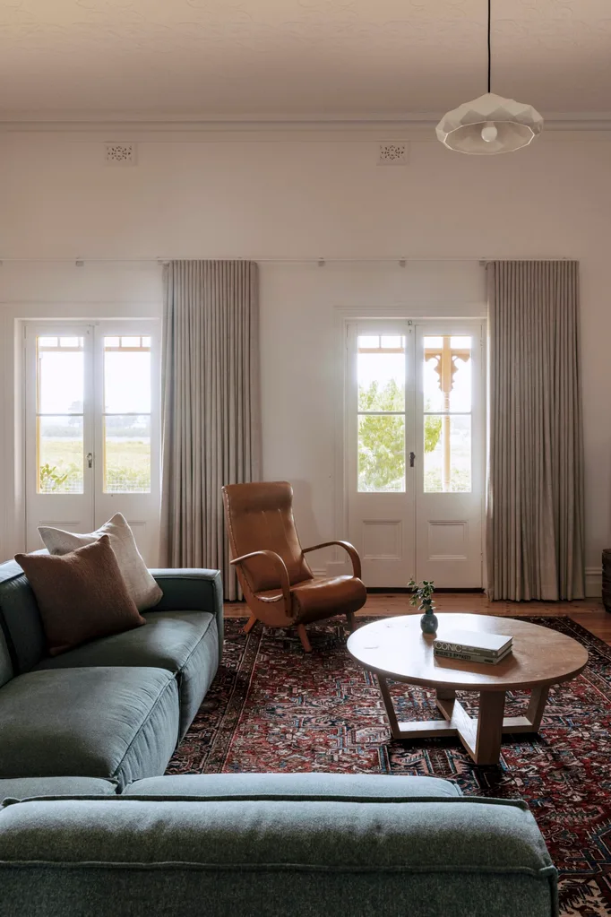 Living room with blue sofa and French windows from Renmark SA home tour