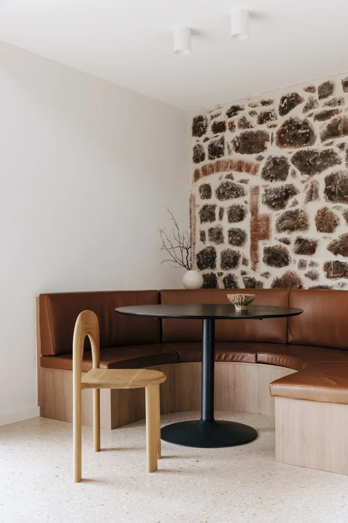 Historic stone wall with dining banquette