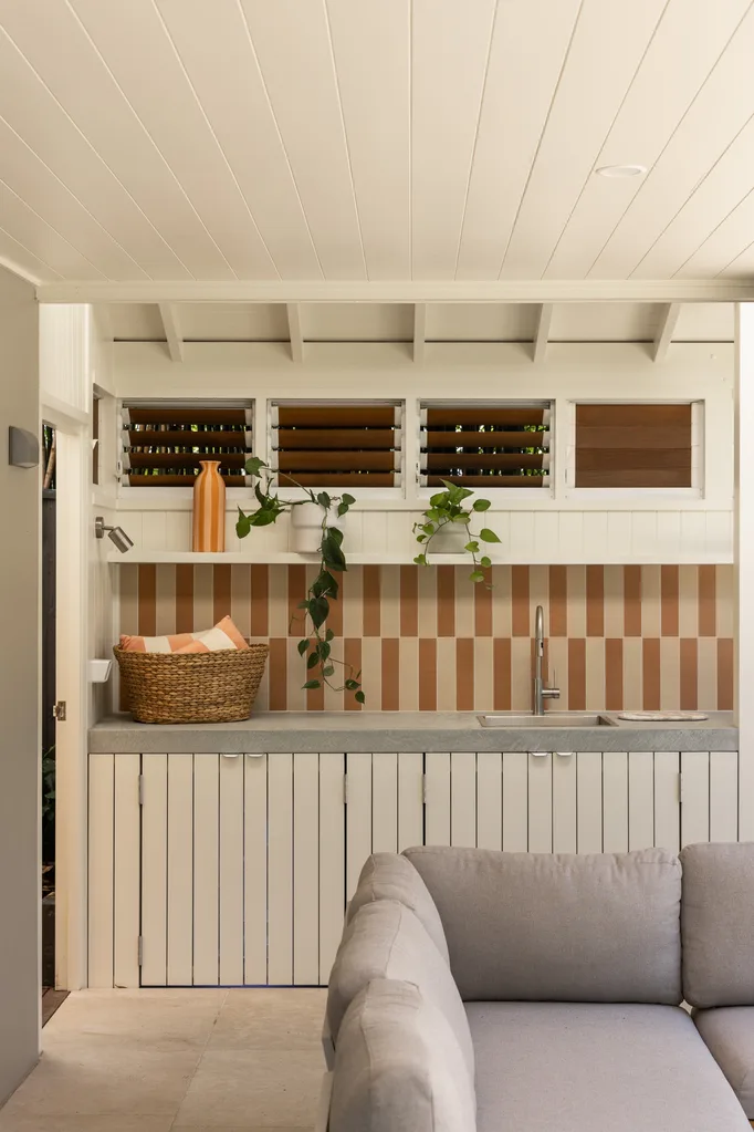 An outdoor lounge area with a bar area