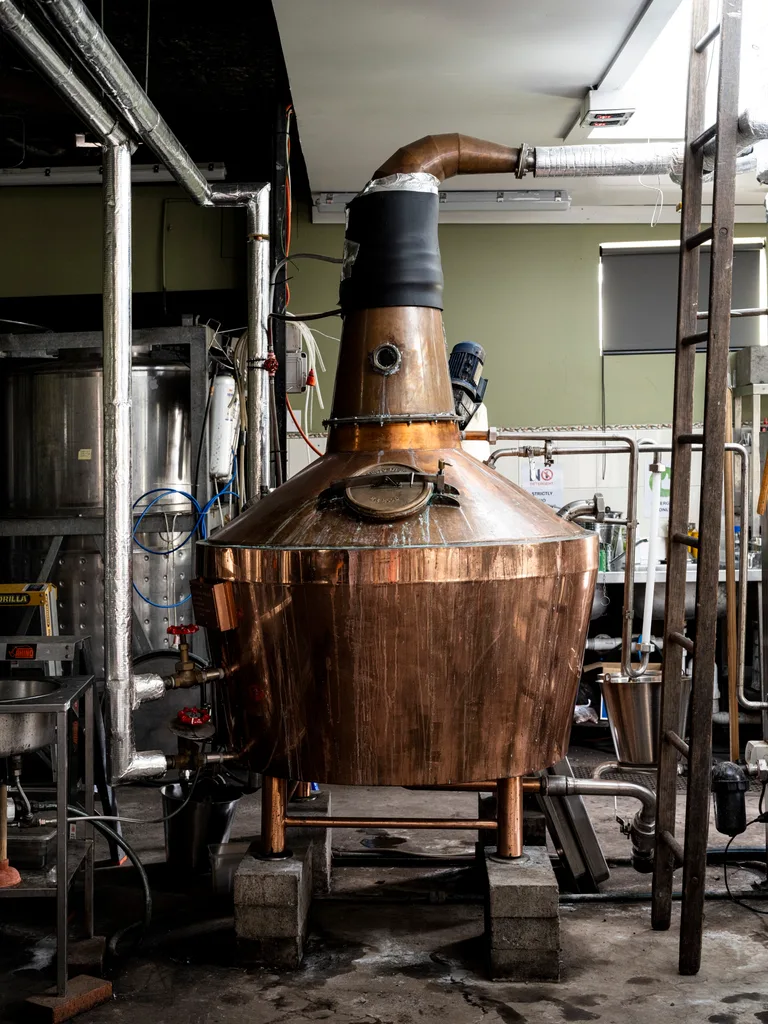 Large brass still in distillery
