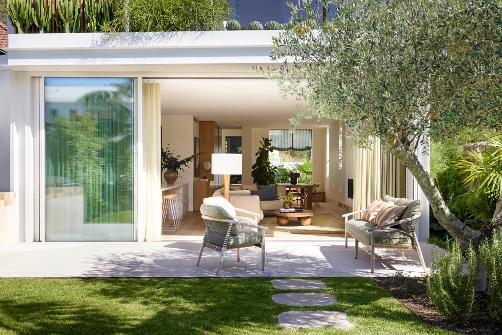 A modern extension with bi-fold doors and a sunny terrace