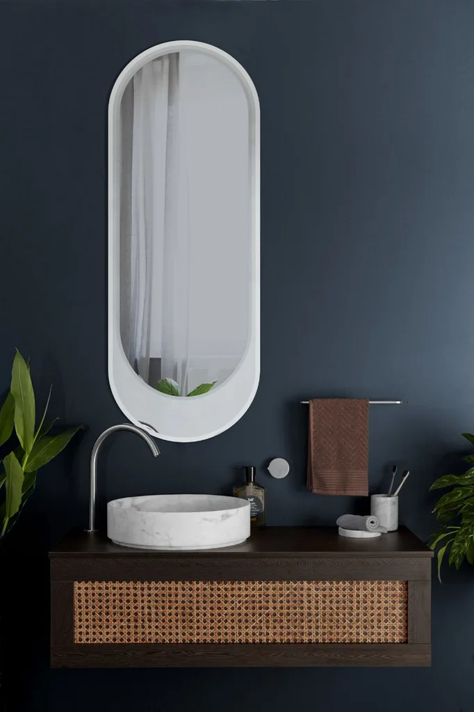 Eccentric tapware by Rogersellers at winning appliances in a moody blue bathroom