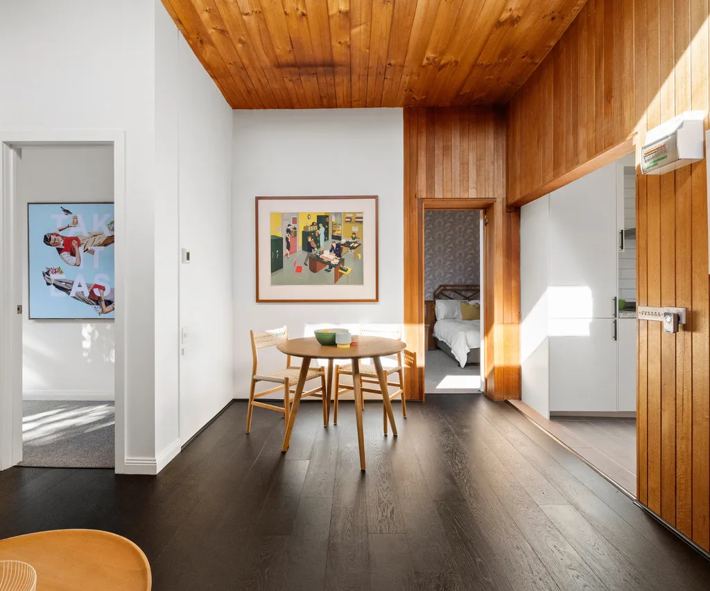 A dining area with timber panelling