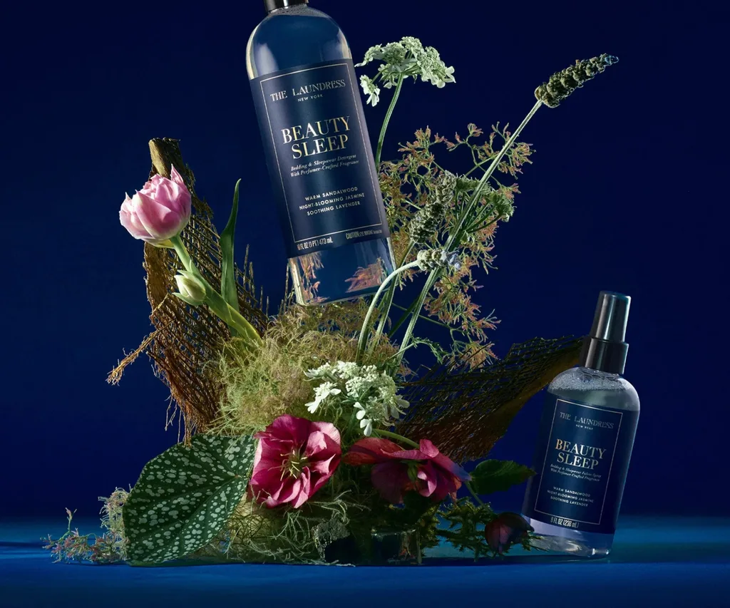 A blue background, flower arrangement and blue laundry products
