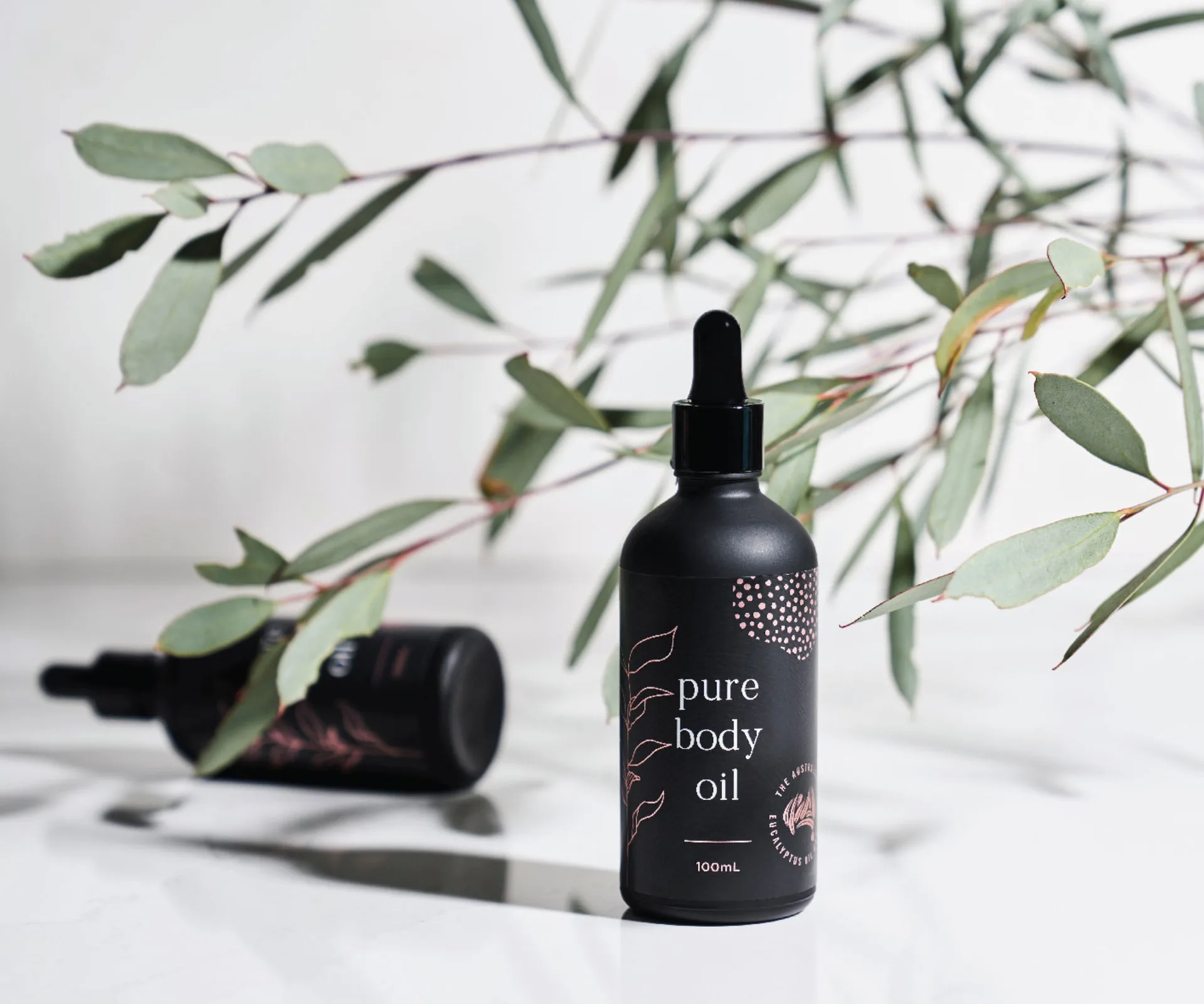 oil bottles and eucalyptus branch tree