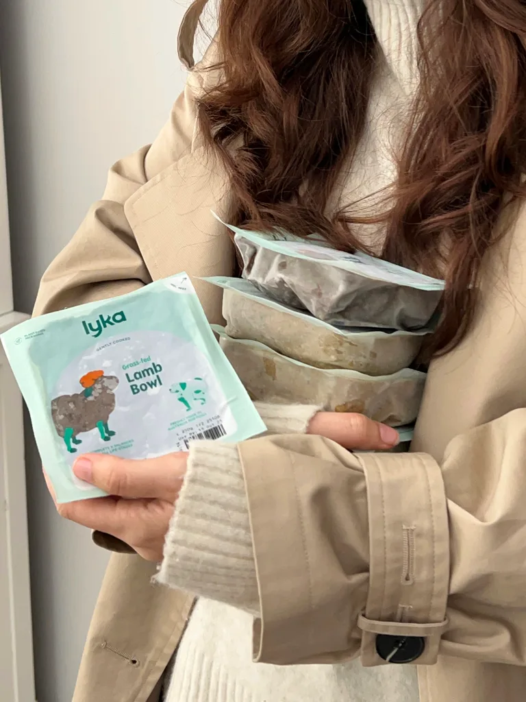 Social media producer, Kate holding Lyka pet food