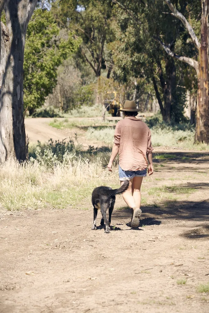 Laura Mathers with her dog on Bundarra Farm