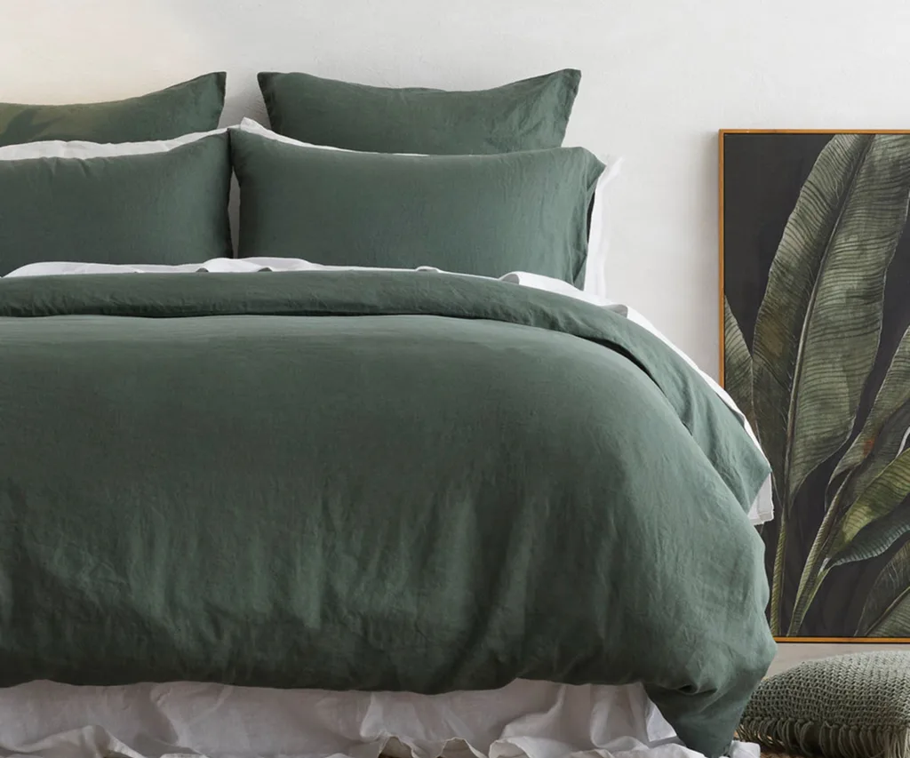 A bed with green sheets