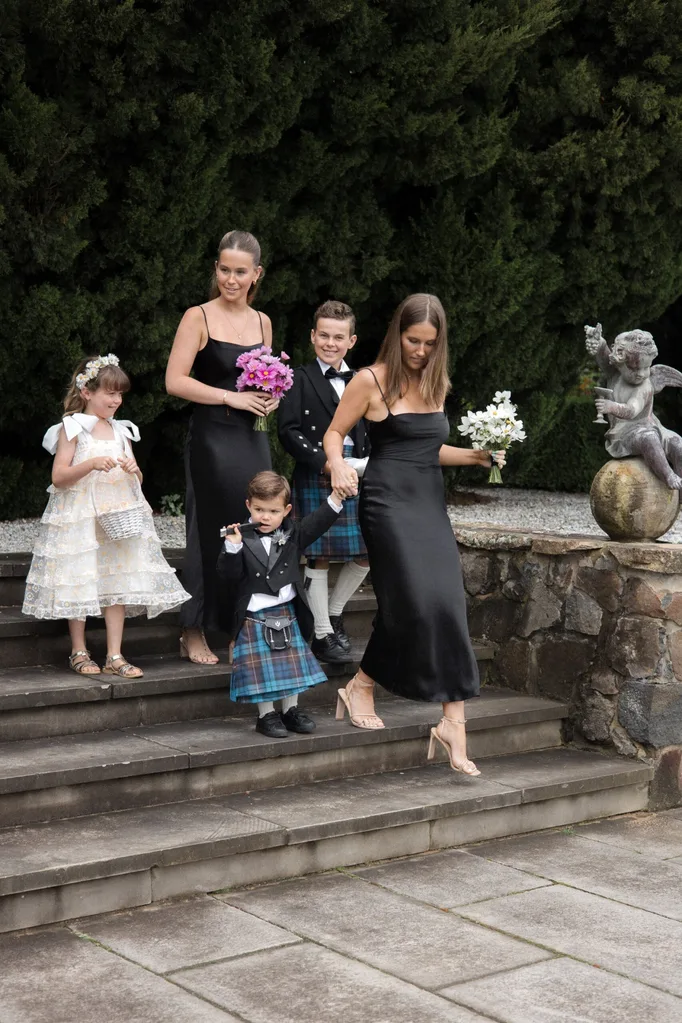 Bridesmaids with a flower girl