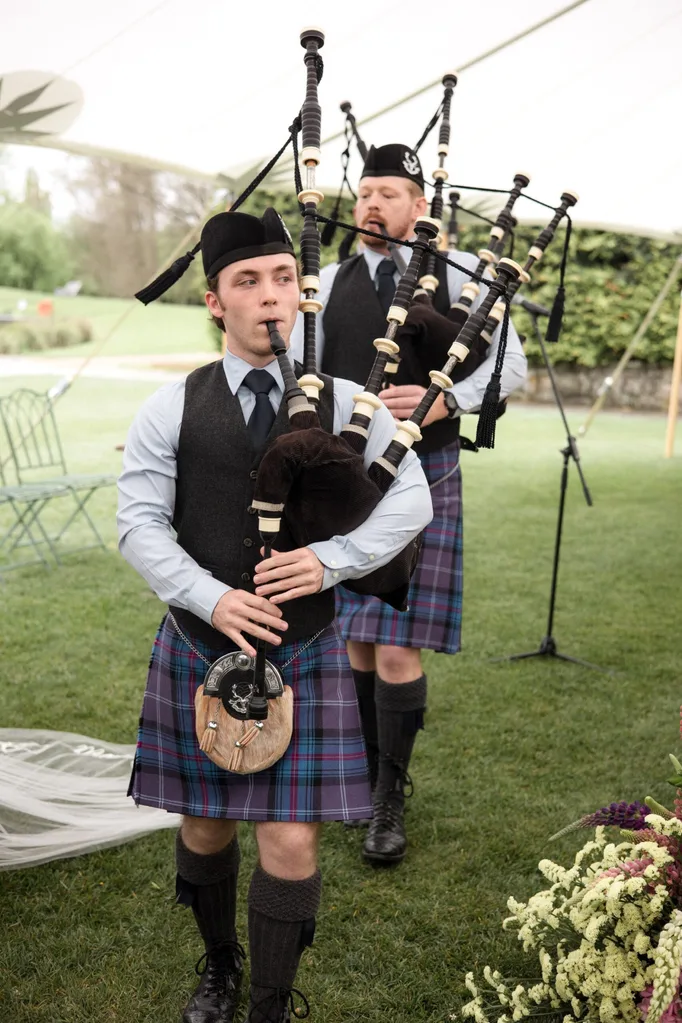Scottish bagpipe players at Sally and Andrew's country wedding