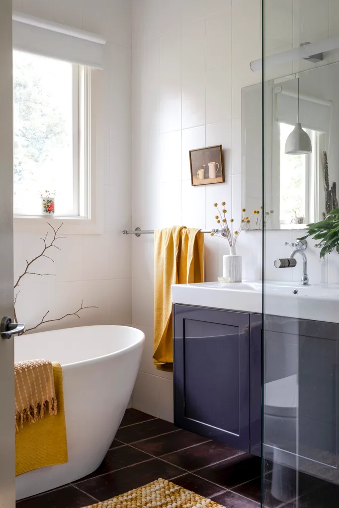 A bathroom with a freestanding bathtub