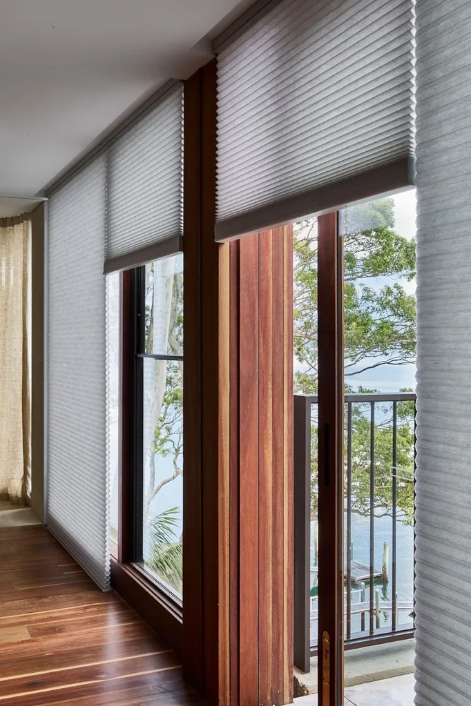 Room with window and Luxaflex blinds