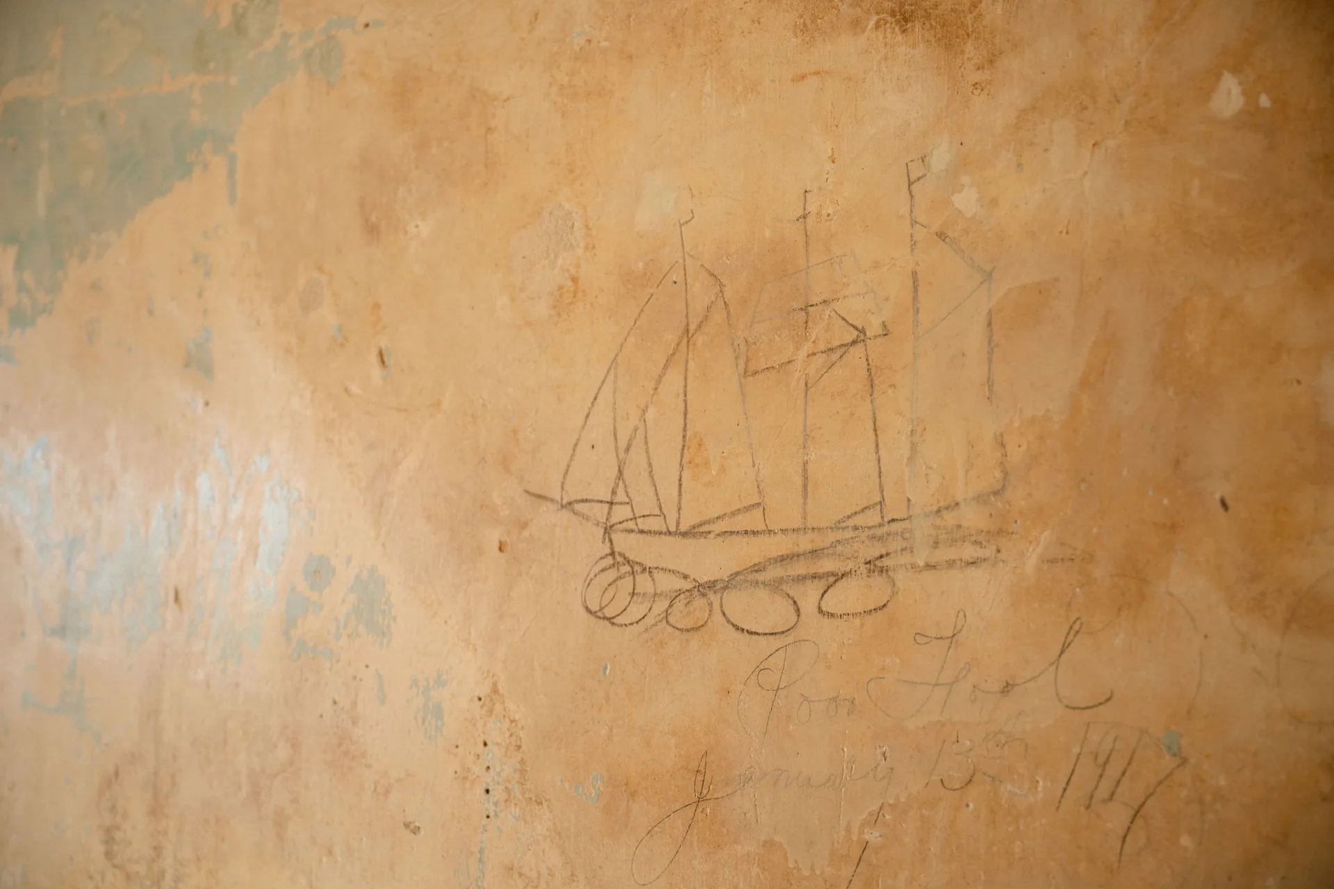 An old drawing of a ship on the walls of Lawsons Estate