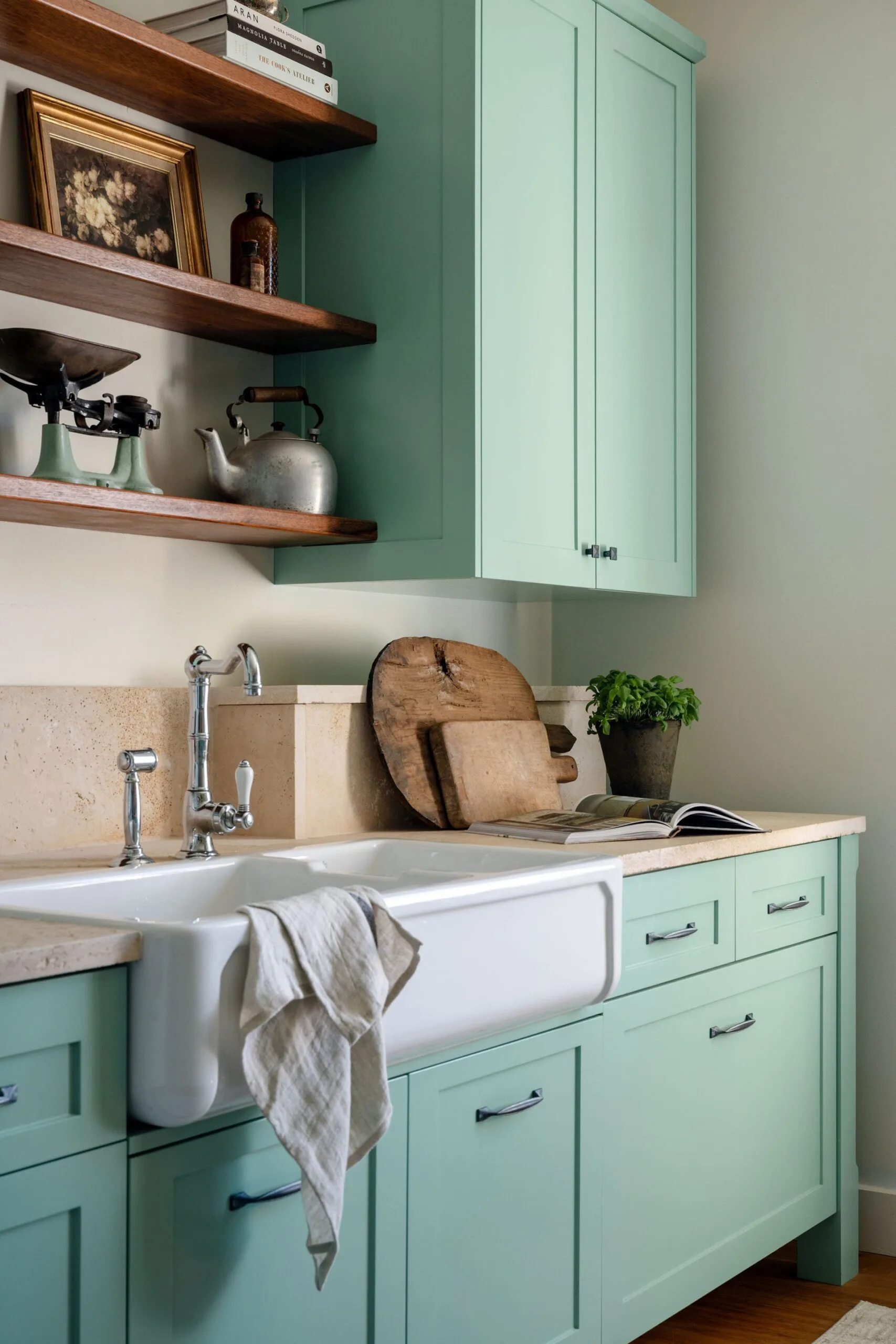 Blue kitchen cabinetry and a farmhouse sink