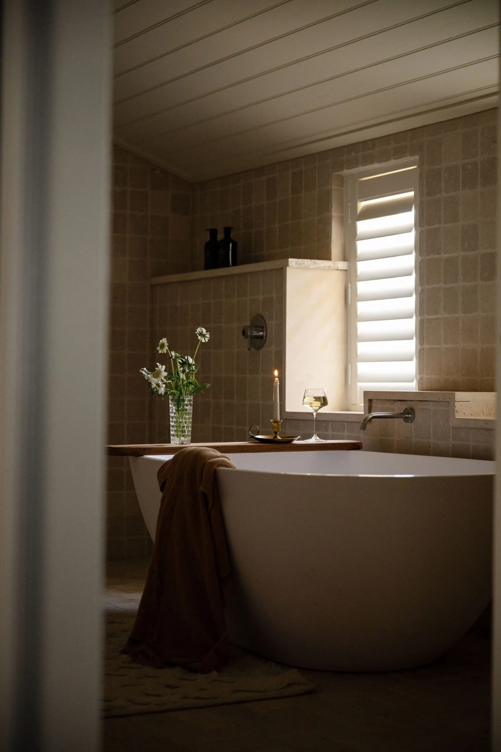 A modern bathroom with a large freestanding bathtub