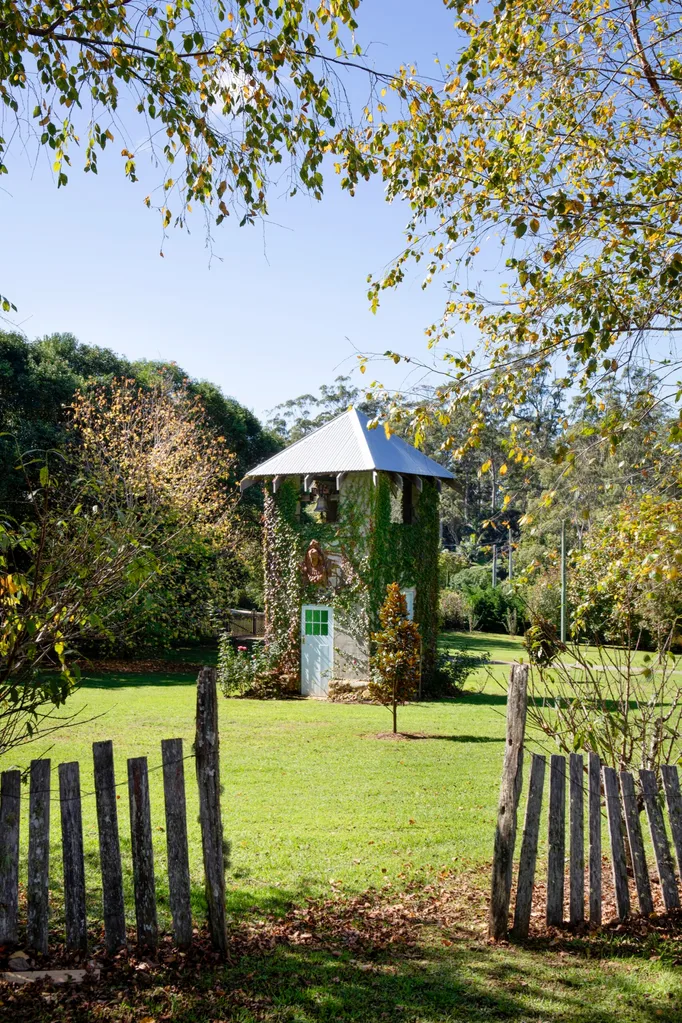 Mt Tamborine garden with a lawn and a bell tower