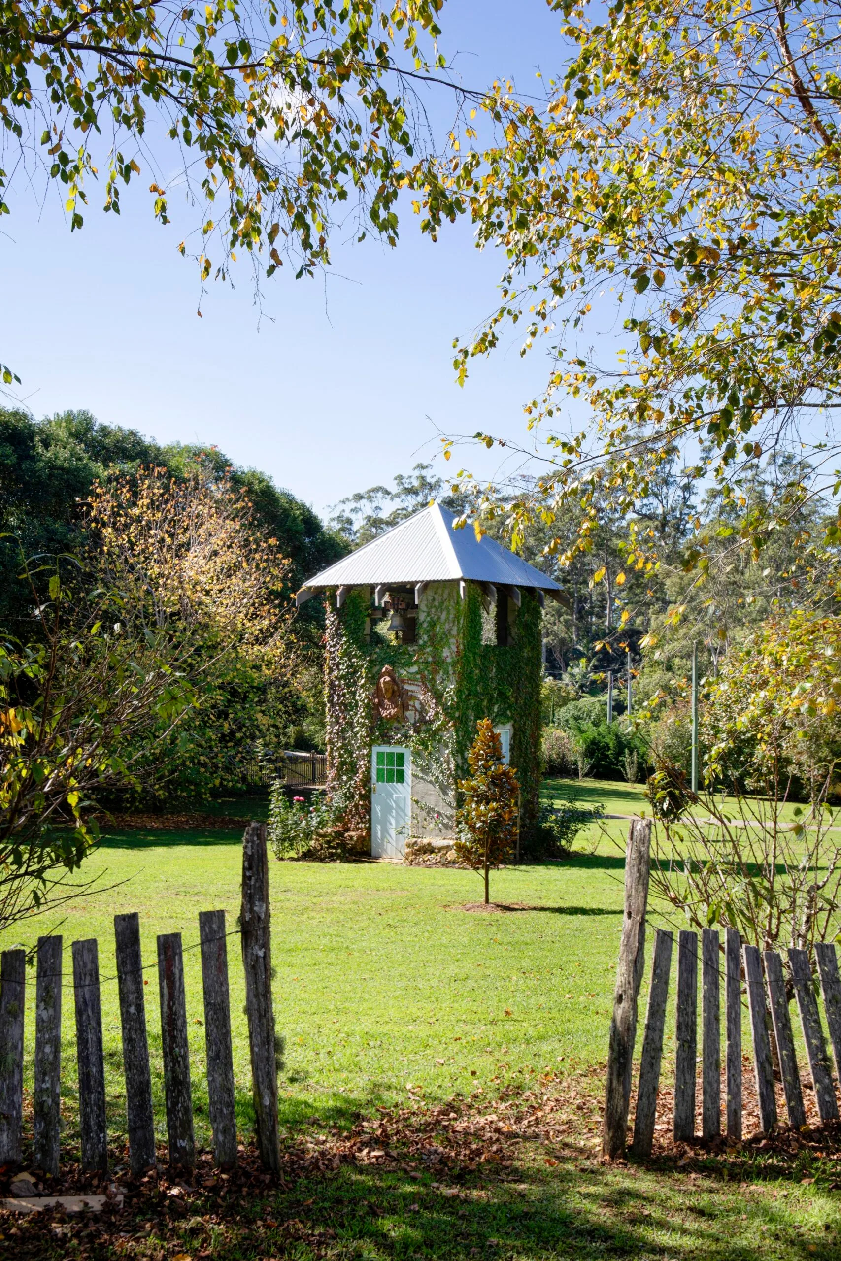 Mt Tamborine garden with a lawn and a bell tower