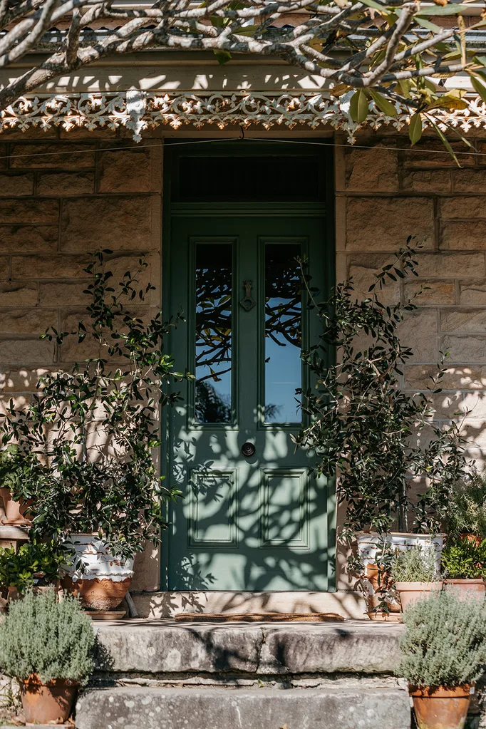 The front door of a historic sandstone cottage