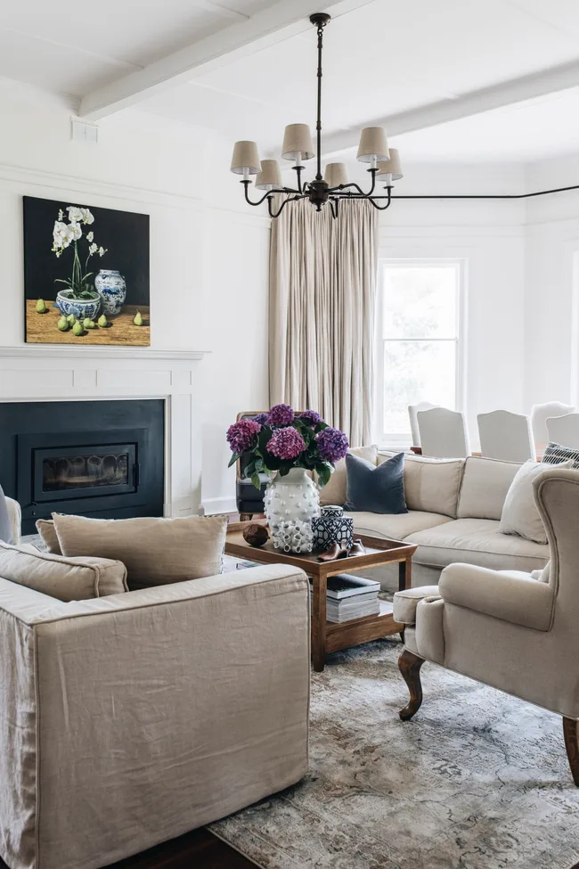 A lounge and dining area with a fireplace