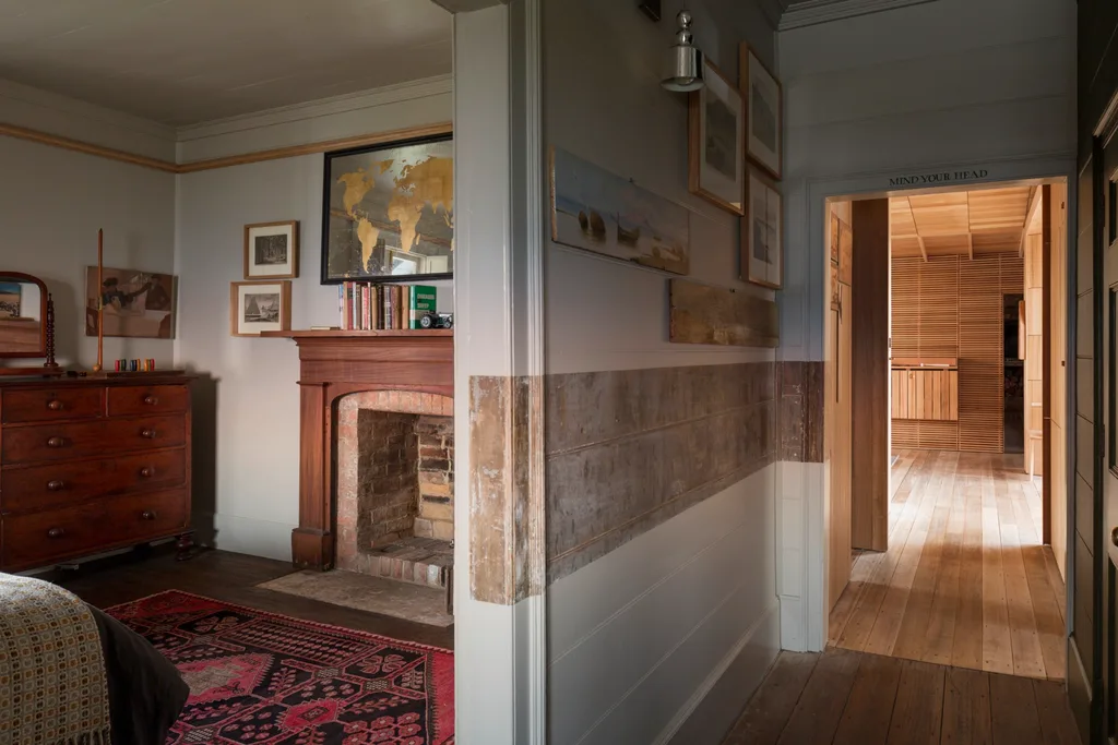 The interiors of a renovated 1840s cottage with a modern timber-lined extension