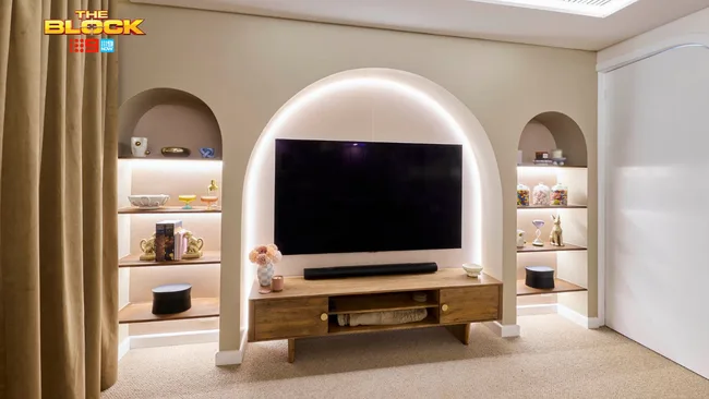 Han and Can delivered a rumpus room on The Block with curved built-in bookshelves and a tv unit.