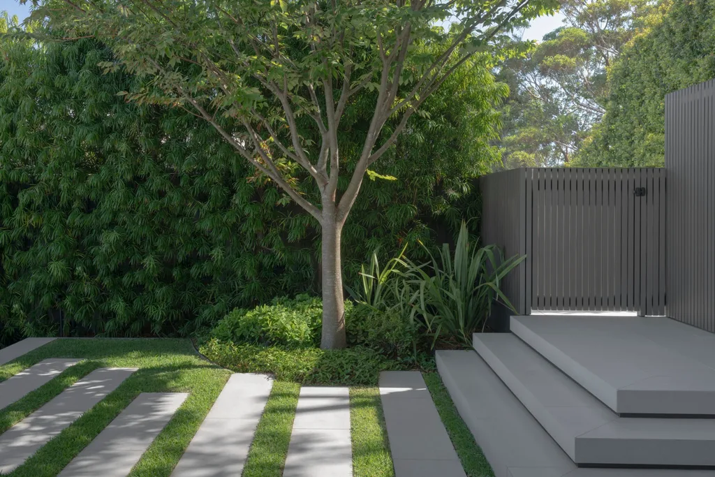 Cantilevered concrete steps lead to steppers