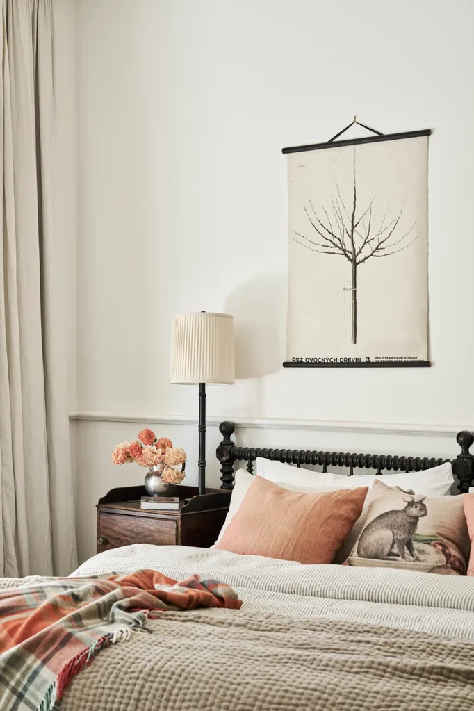 A beige bedroom with orange accents