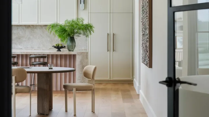 A contemporary kitchen and dining area