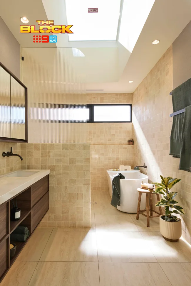 Robby and Mat's neutral toned bathroom with skylight