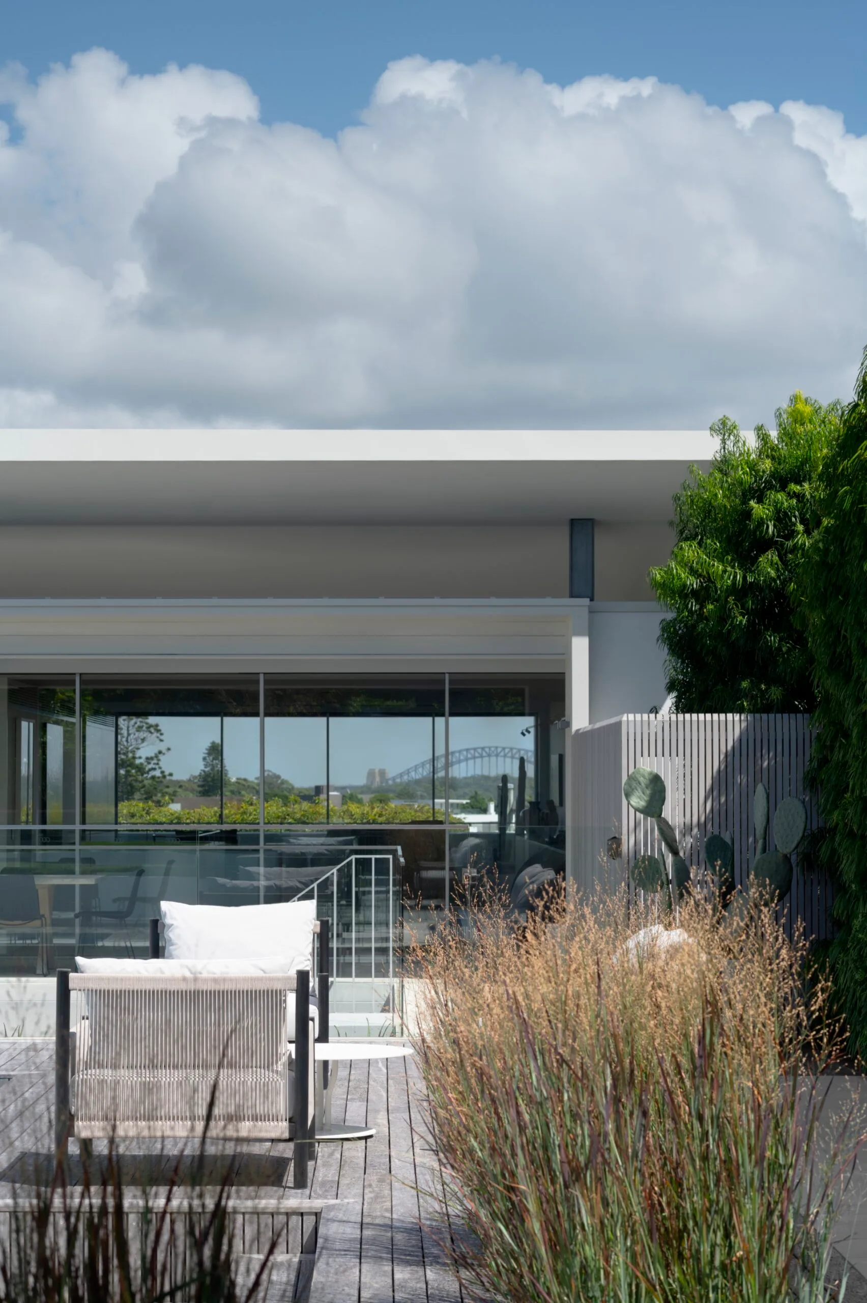 Hardwood deck that flows from the pool to the living area.