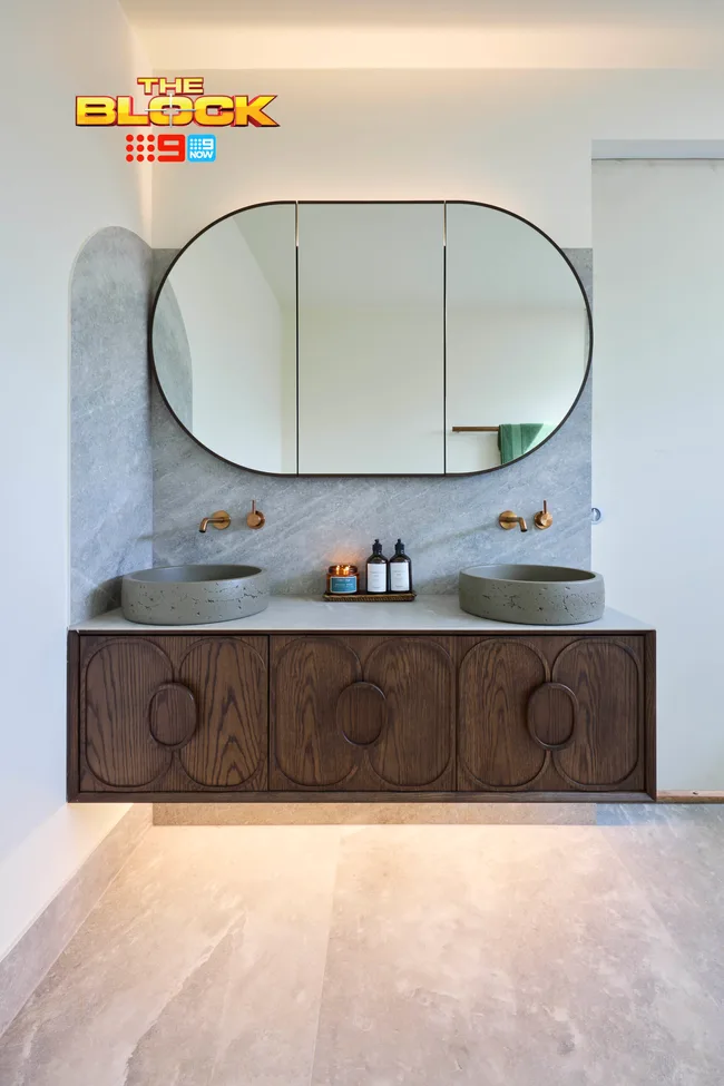 Sonny and Alicia's floating timber vanity with a round mirror