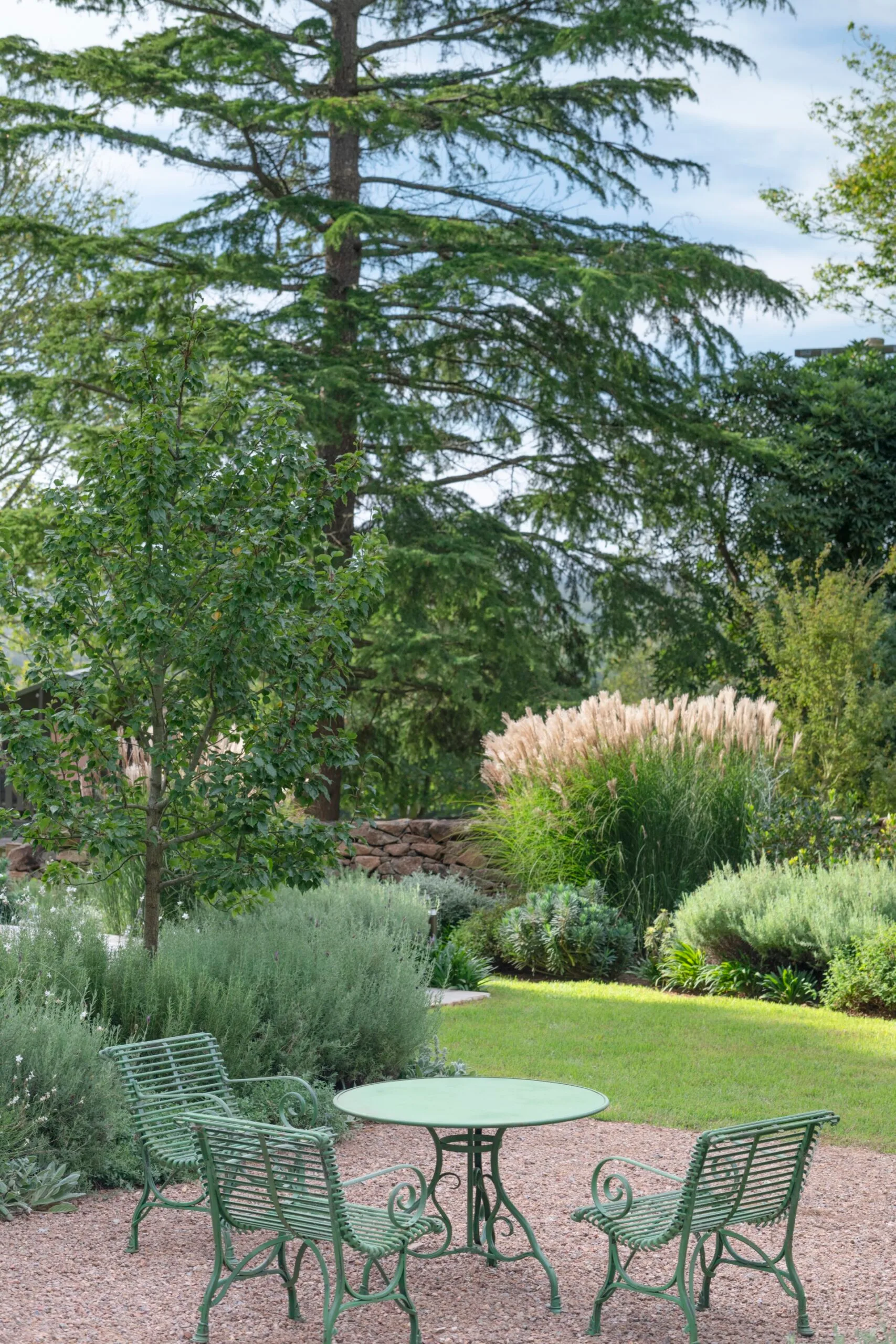 A green outdoor dining setting