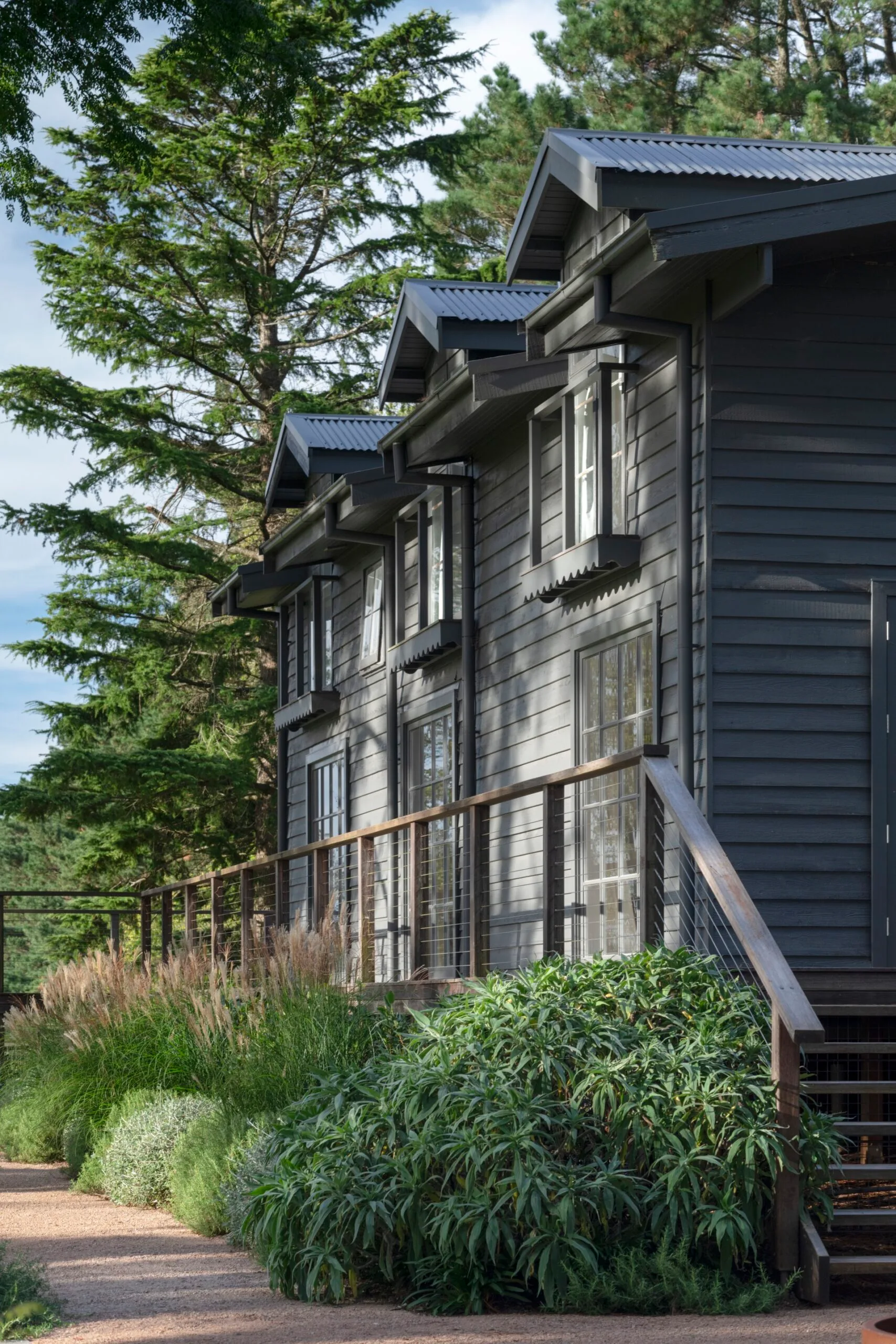 A weatherboard home surrounded by trees