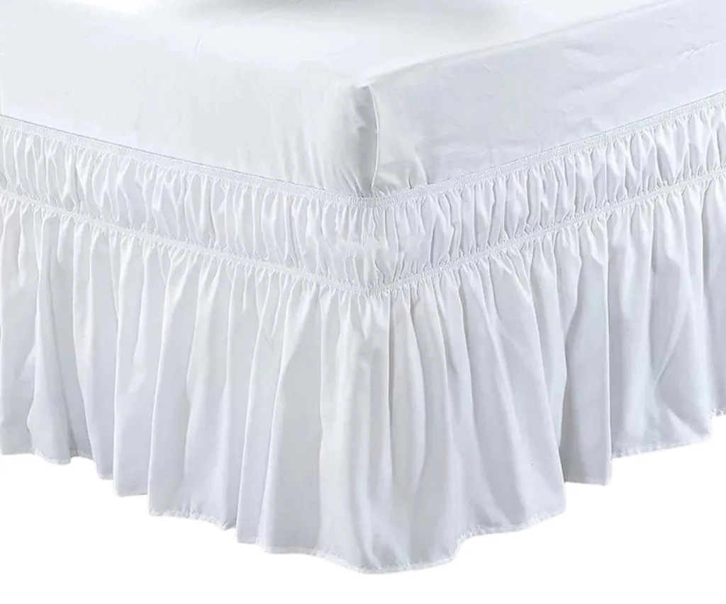 A white ruffled bed skirt