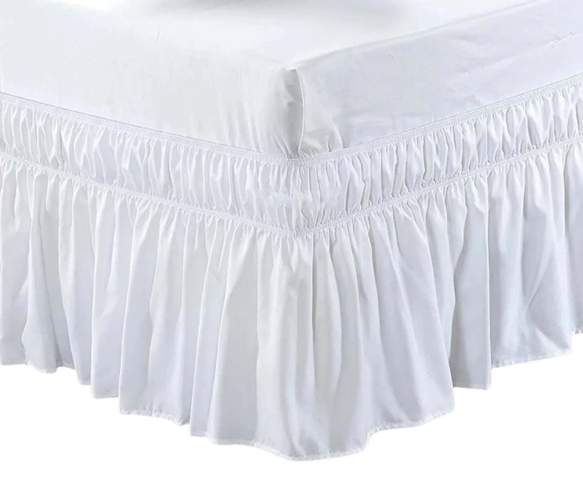 A white ruffled bed skirt