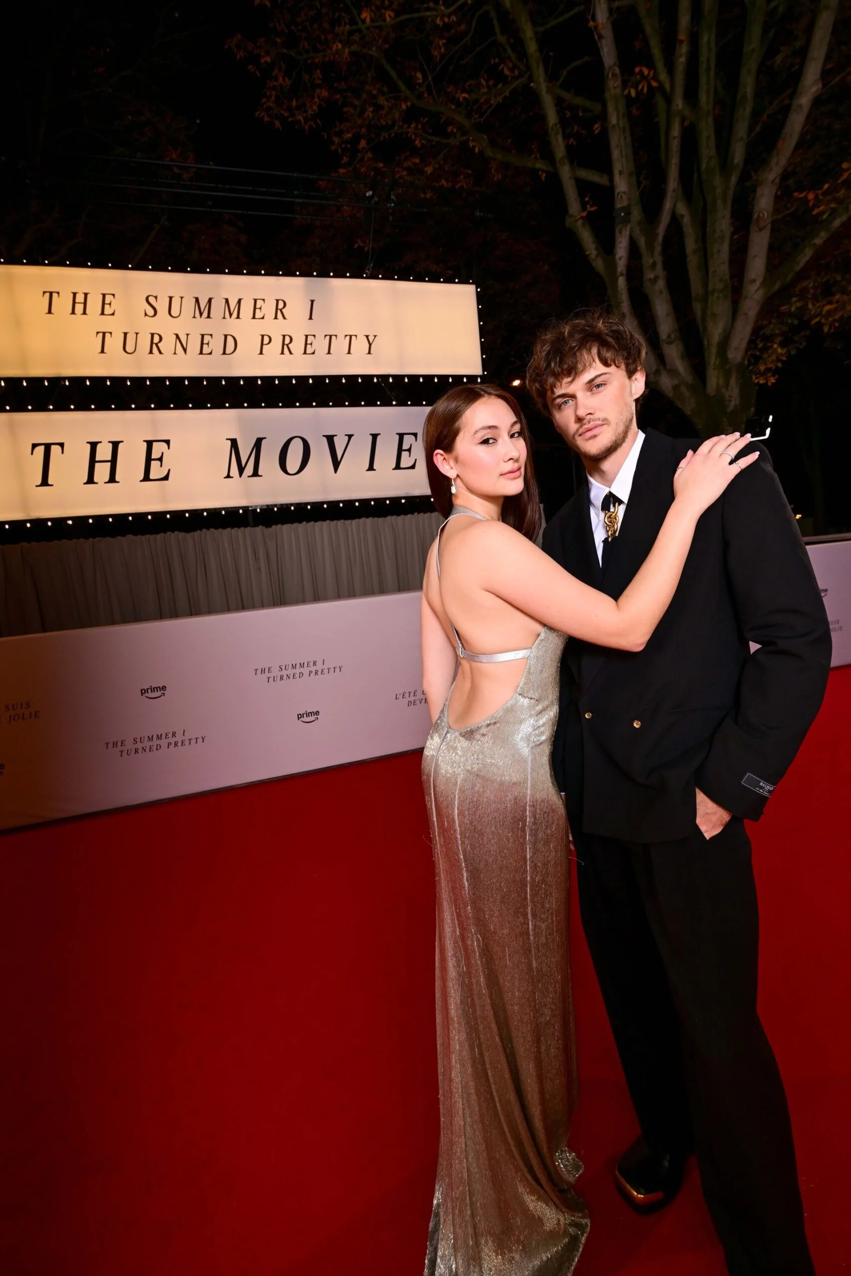 Lola Tung and Christopher Briney at a red carpet event for the announcement of The Summer I Turned Pretty movie