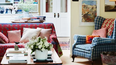 A colourful living room with a patterned armchair