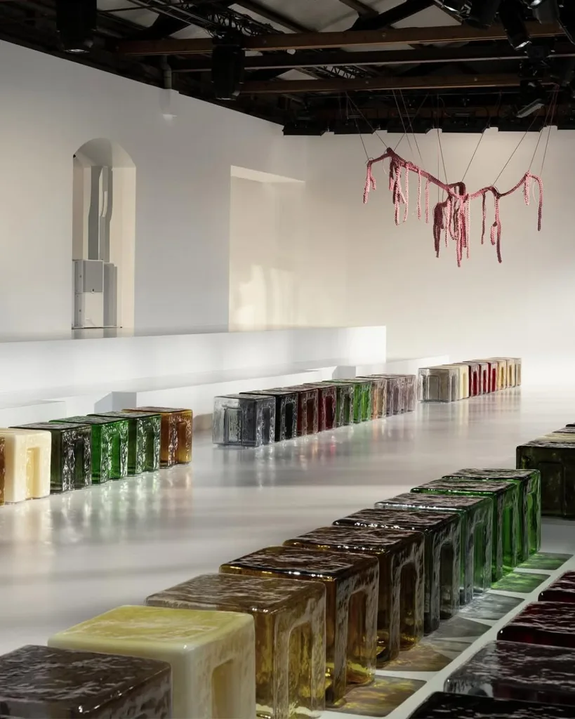 For the Bottega Veneta Summer 2026 show set, 6:AM designed Murano blown-glass cubes in a bespoke palette of ten colours.